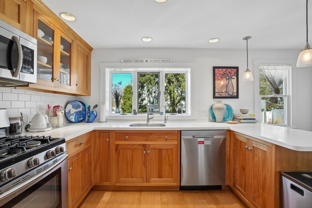 12 Hawley Road Scituate, MA 02066 - Photo 2 of 24 a kitchen with a sink stove and cabinets