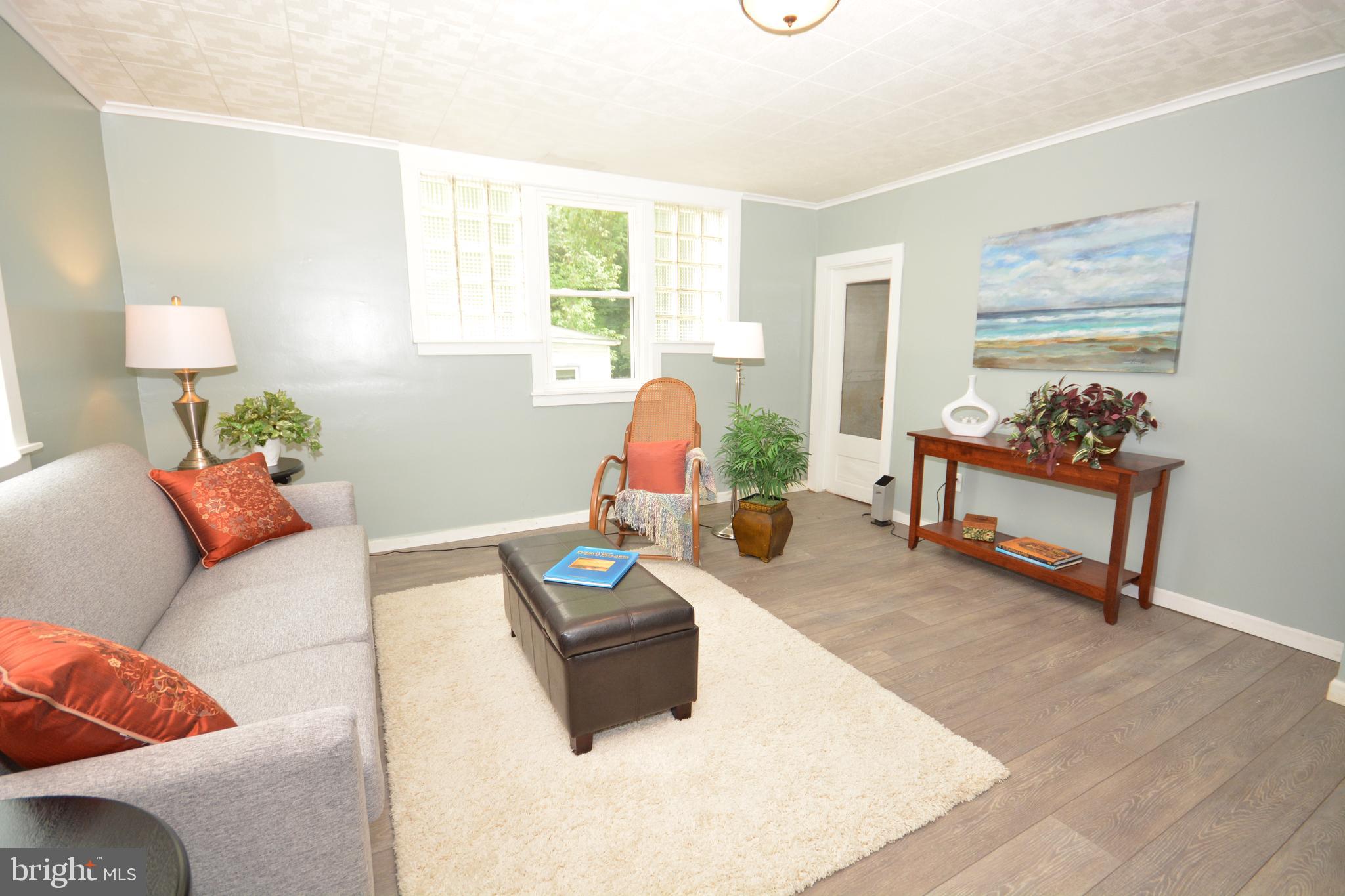 275 Ridge Avenue Ephrata, PA 17522 - Photo 6 of 25 Living Room w/ Door to Storage/Attic