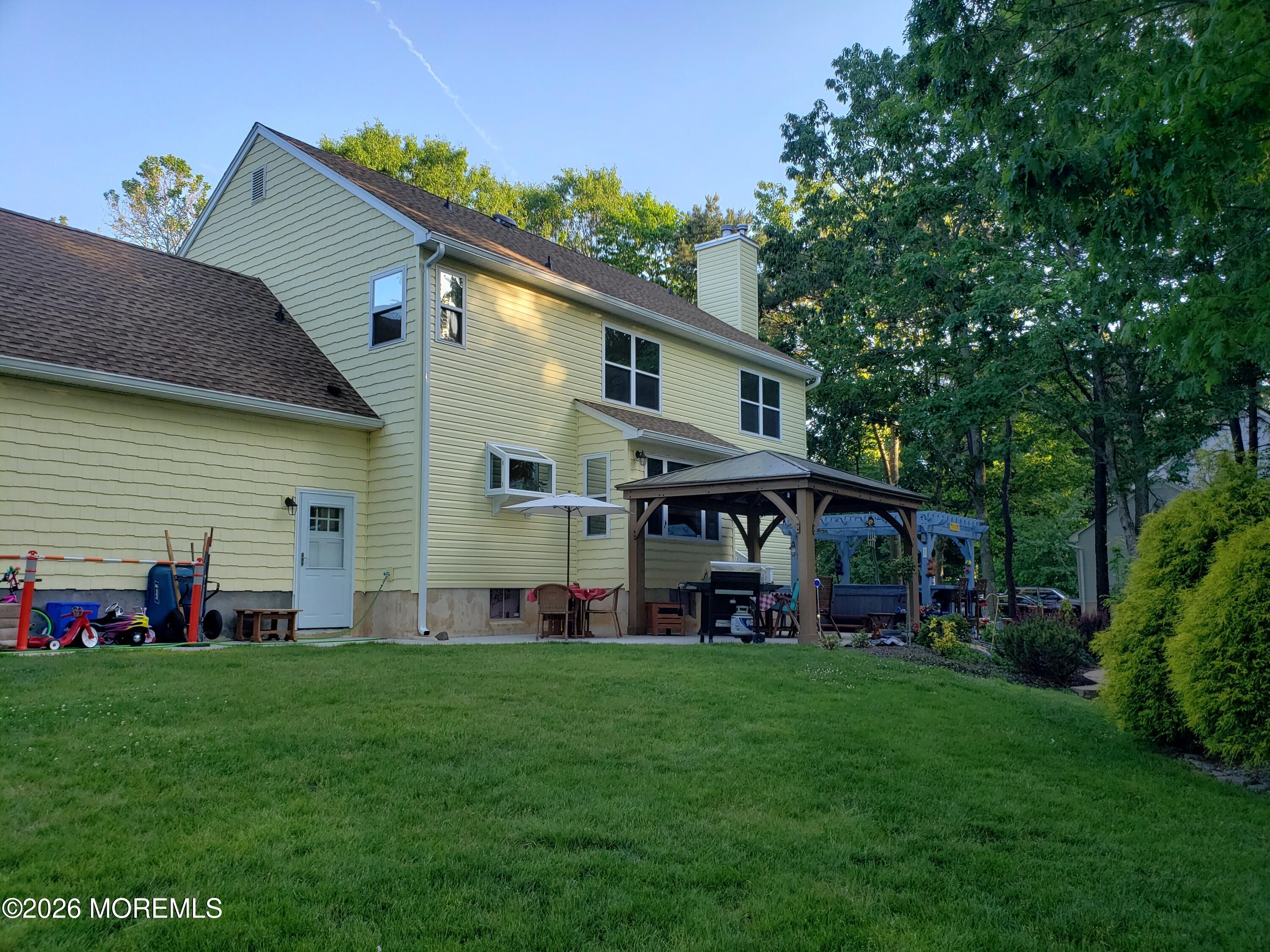 394 Jackson Mills Road Jackson, NJ 08527 - Photo 2 of 7 a front view of house with yard and green space