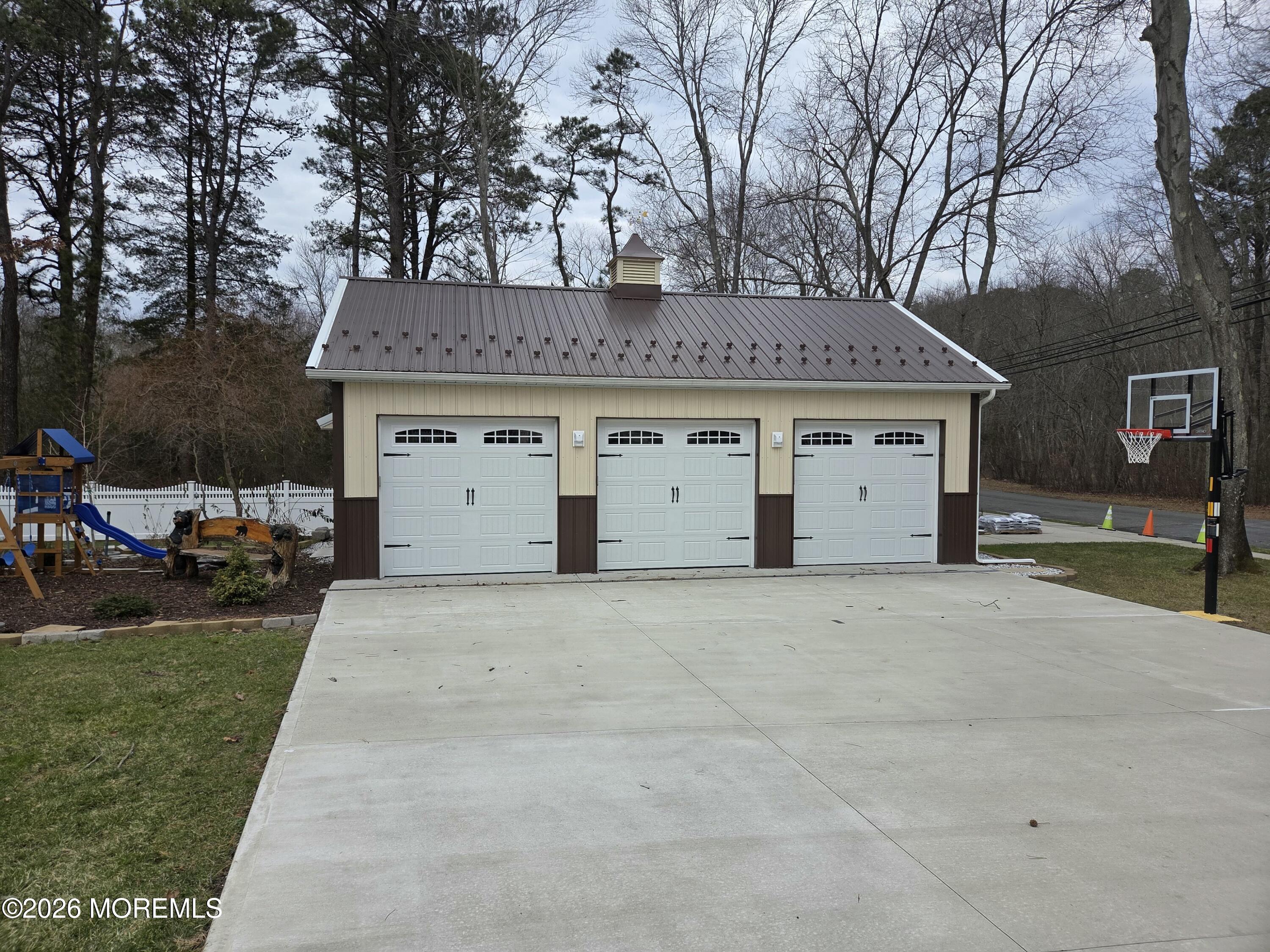 394 Jackson Mills Road Jackson, NJ 08527 - Photo 3 of 7 a view of a white house with a yard and garage