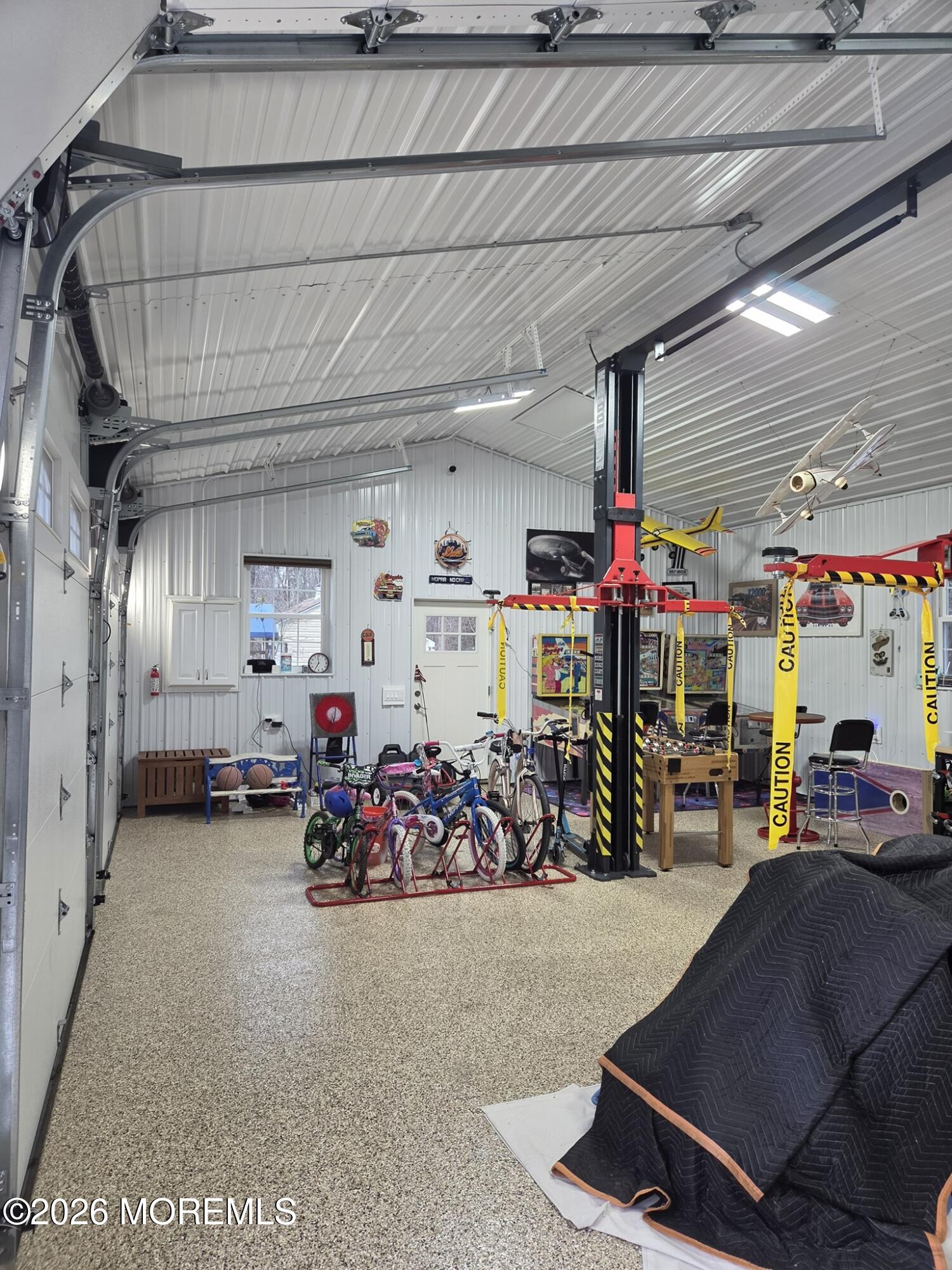 394 Jackson Mills Road Jackson, NJ 08527 - Photo 4 of 7 a view of a garage with a white car parked