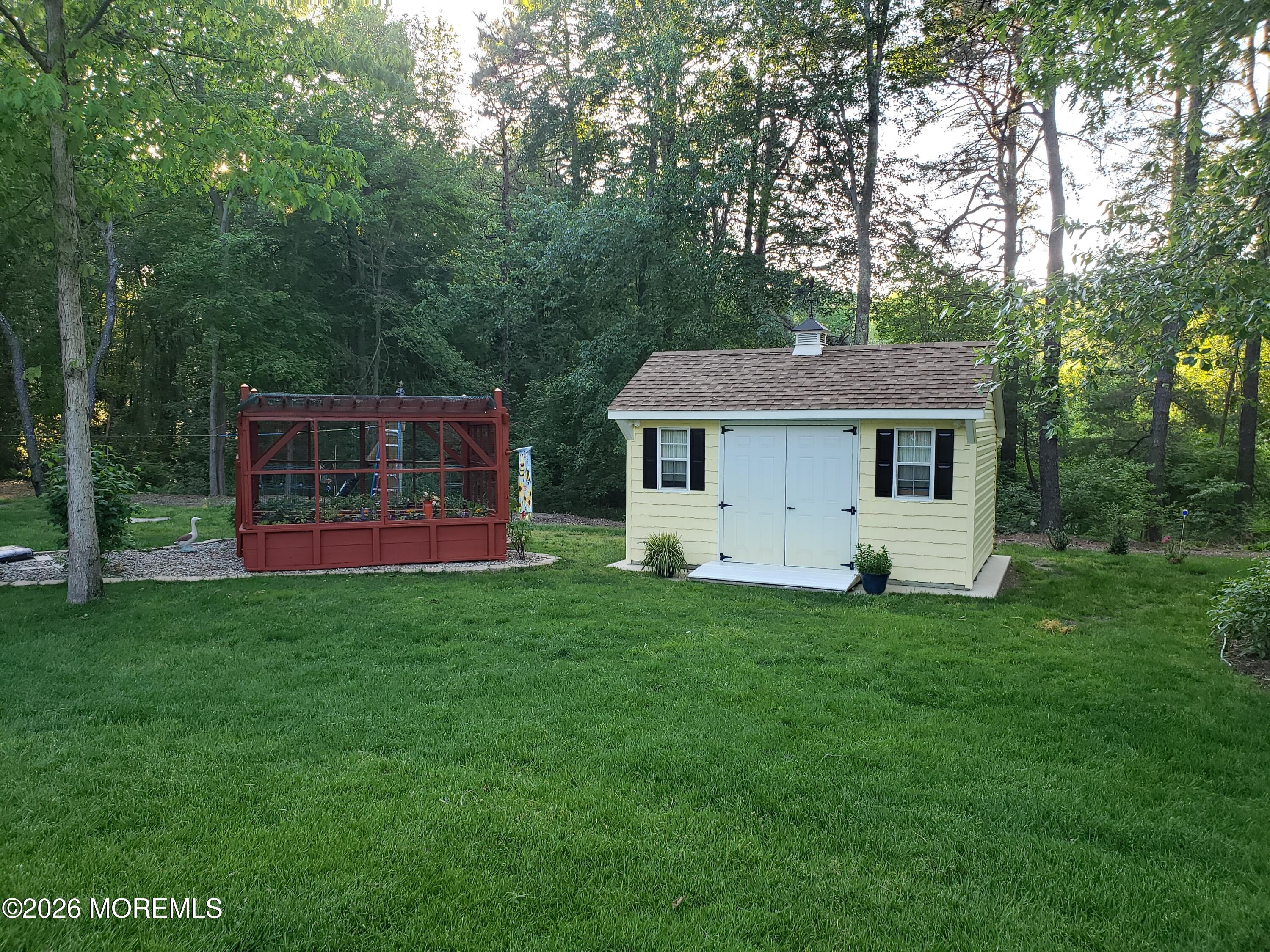 394 Jackson Mills Road Jackson, NJ 08527 - Photo 6 of 7 a view of a house with backyard