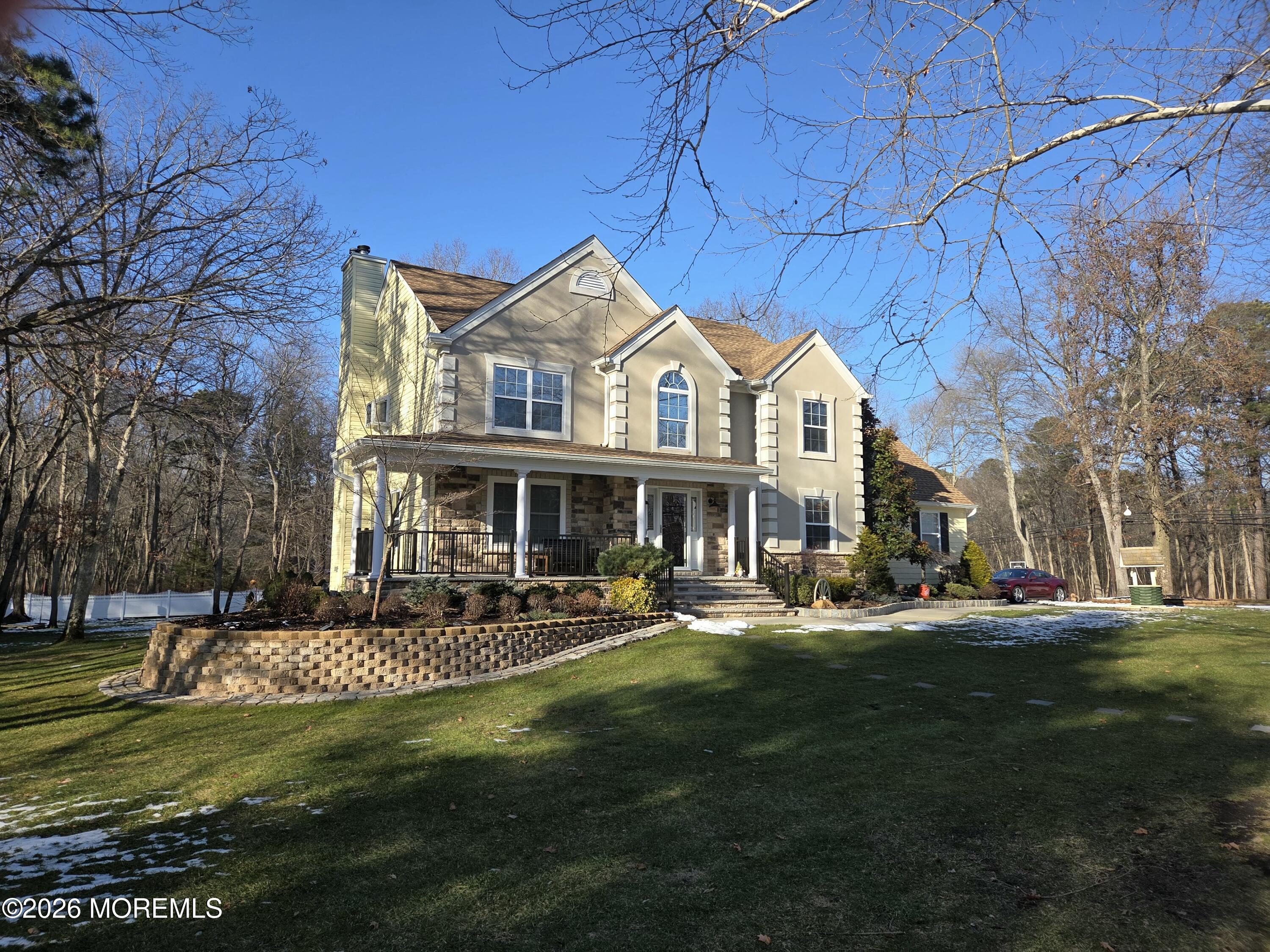 394 Jackson Mills Road Jackson, NJ 08527 - Photo 7 of 7 a front view of a house with a garden