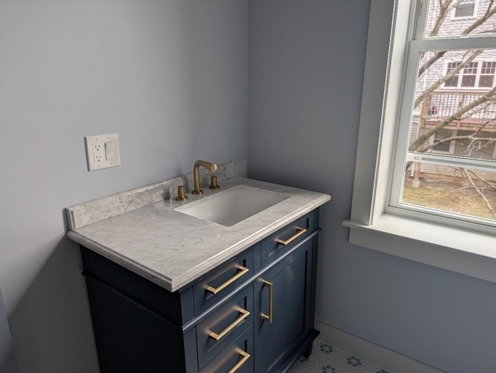 31 Homestead Street, Unit 2 Boston, MA 02121 - Photo 20 of 21 a utility room with a sink a vanity and window