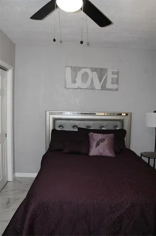 a white toilet sitting next to a bathroom sink
