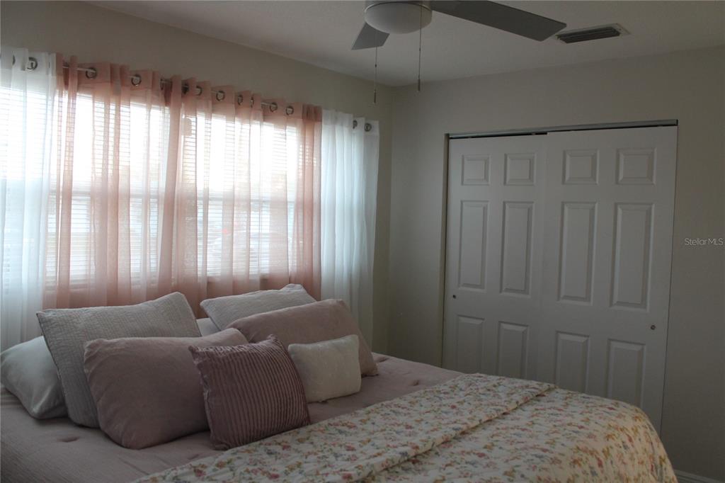 7423 Star Dust Drive Port Richey, FL 34668 - Photo 8 of 23 a bedroom with a bed and a window