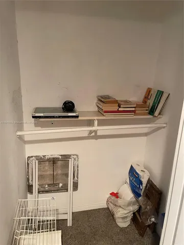 a view of swimming pool with outdoor seating and plants