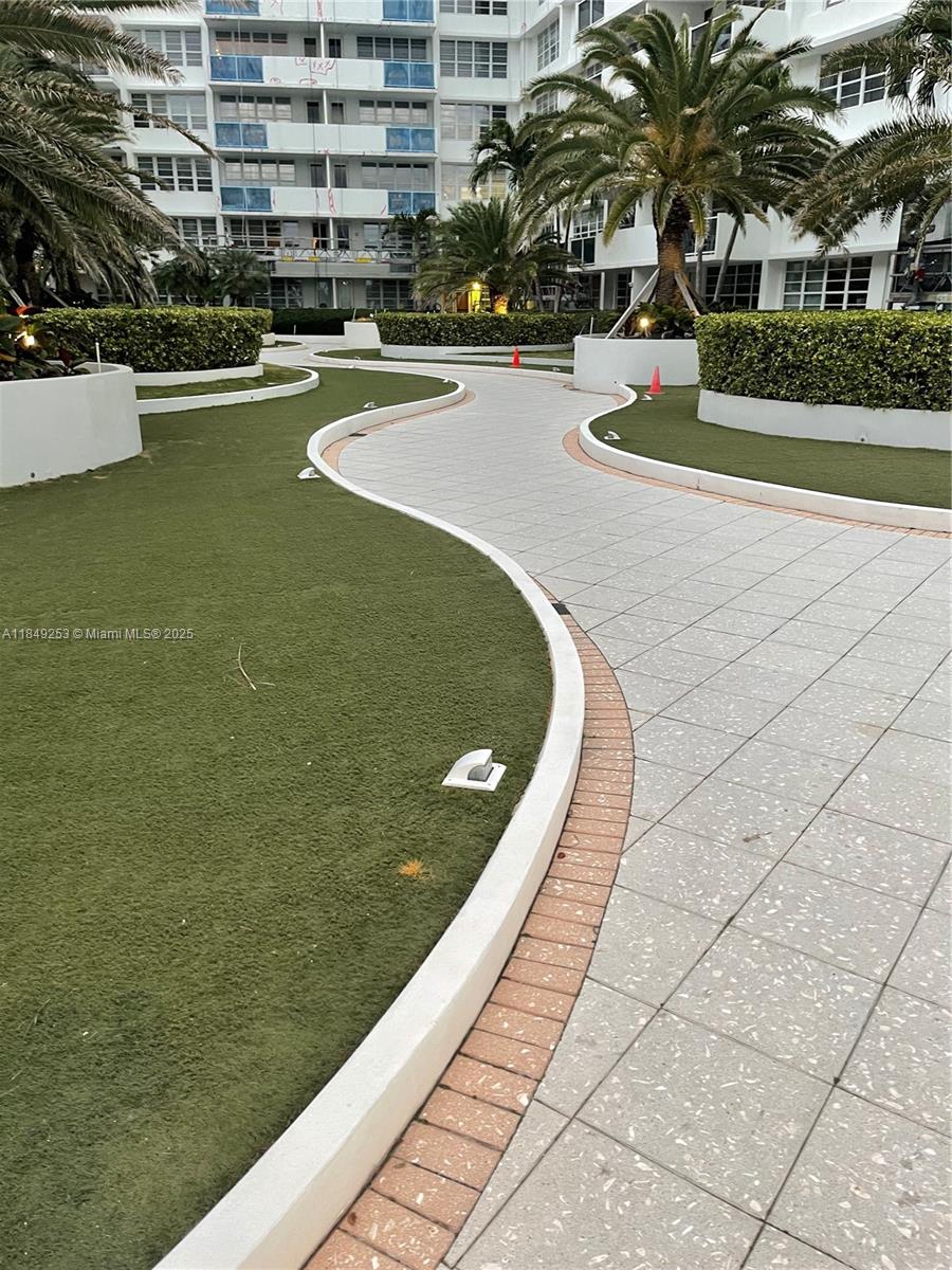 100 Lincoln Road, Unit 833 Miami Beach, FL 33139 - Photo 22 of 30 a view of swimming pool with outdoor seating and plants