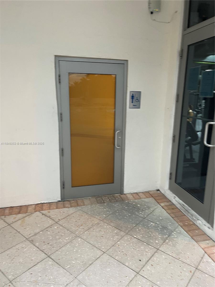 100 Lincoln Road, Unit 833 Miami Beach, FL 33139 - Photo 28 of 30 a view of an empty room with wooden floor