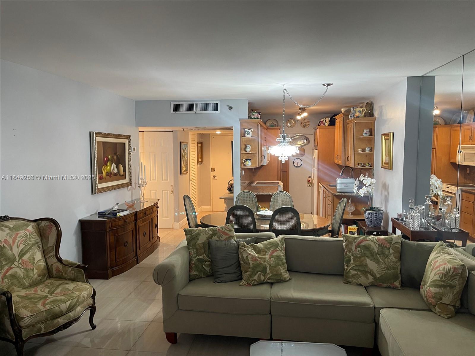 100 Lincoln Road, Unit 833 Miami Beach, FL 33139 - Photo 9 of 30 a living room with furniture and a couch