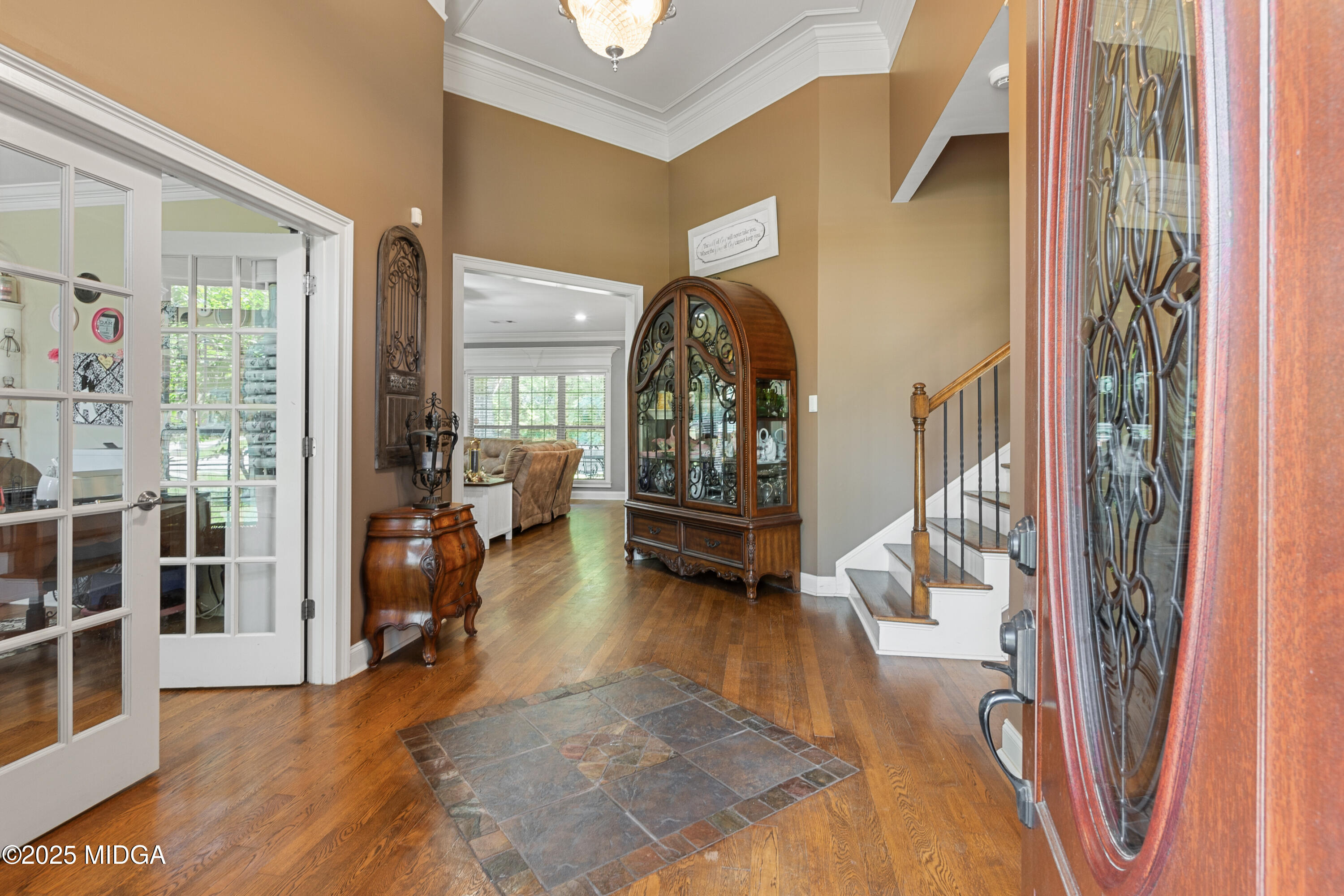 105 River Rock Court Perry, GA 31069 - Photo 11 of 61 a view of living room filled with furniture and a floor to ceiling window