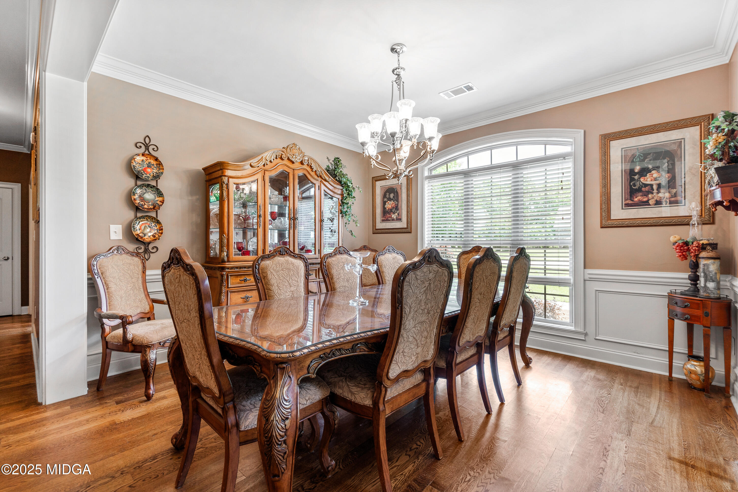 105 River Rock Court Perry, GA 31069 - Photo 13 of 61 a view of a dining room with furniture wooden floor and chandelier