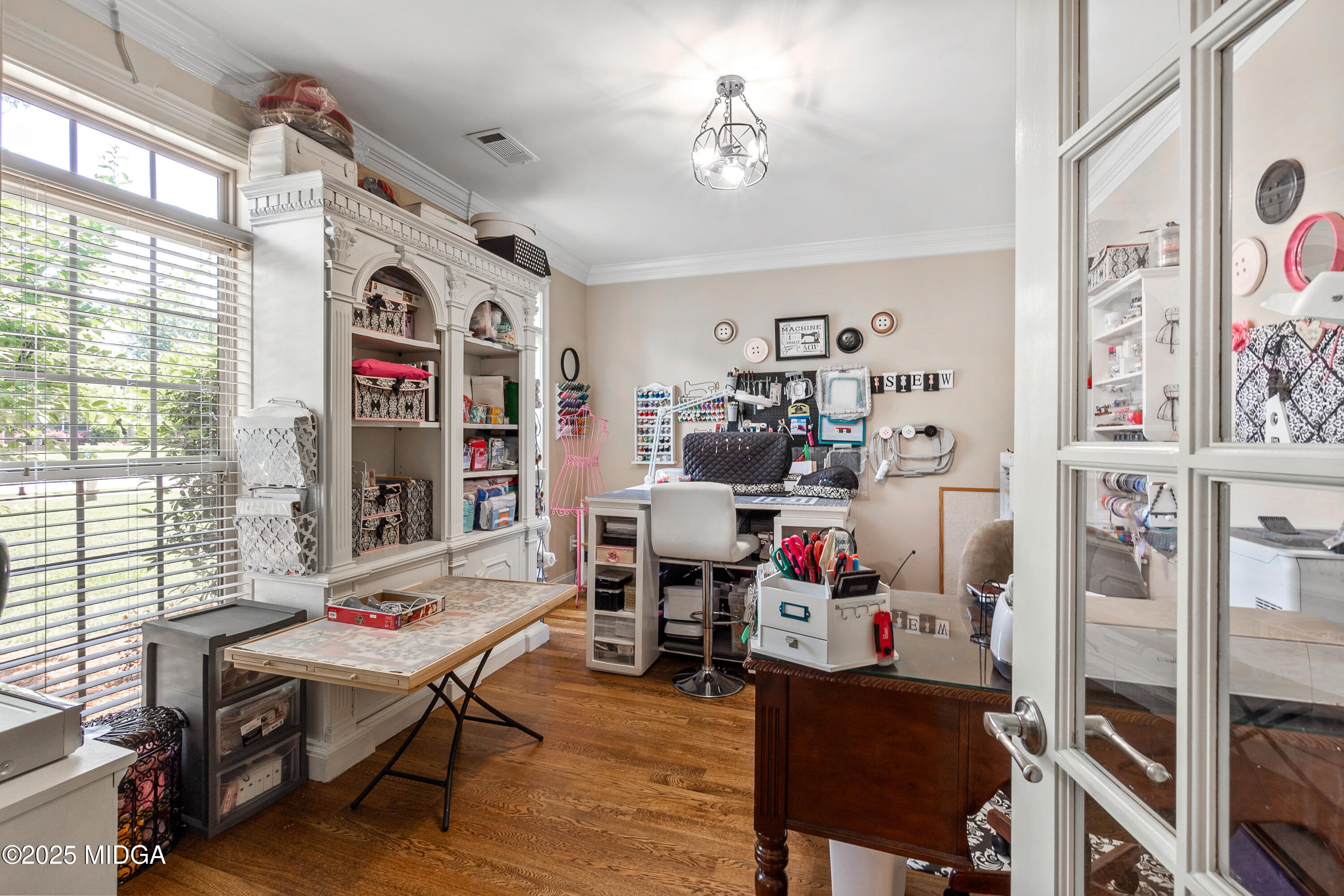 105 River Rock Court Perry, GA 31069 - Photo 15 of 61 a living room with lots of furniture and gym equipment