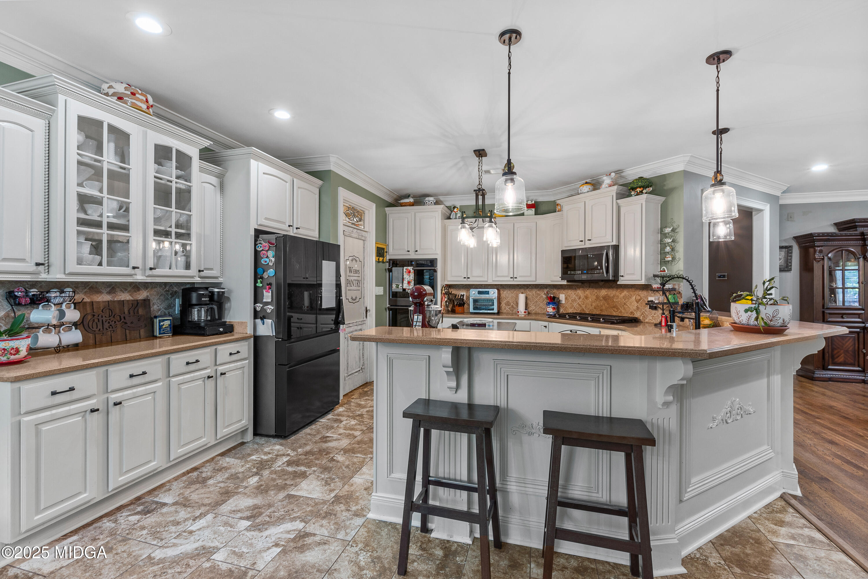 105 River Rock Court Perry, GA 31069 - Photo 23 of 61 a large kitchen with kitchen island a large island in it