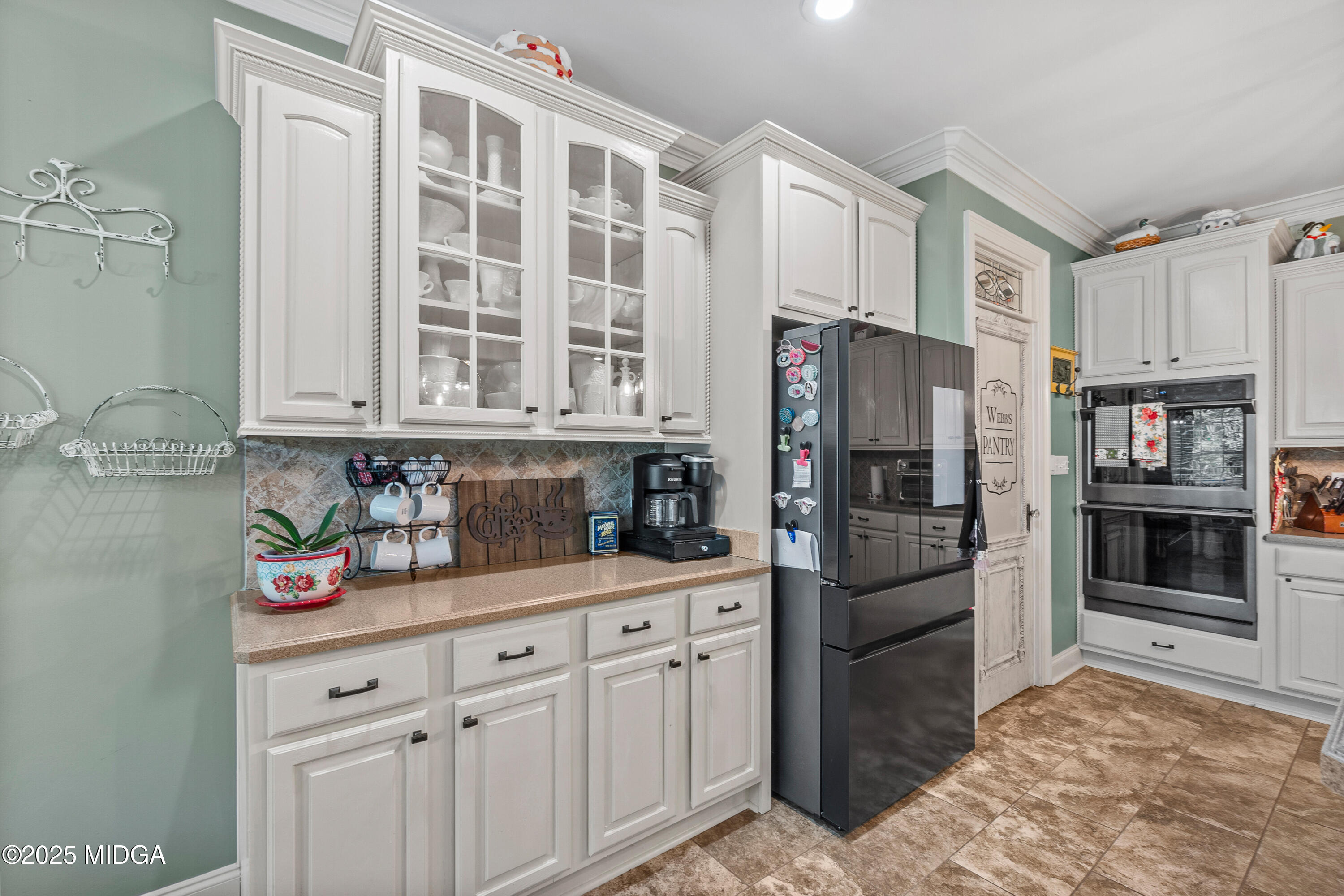 105 River Rock Court Perry, GA 31069 - Photo 25 of 61 a kitchen with stainless steel appliances granite countertop a refrigerator and cabinets