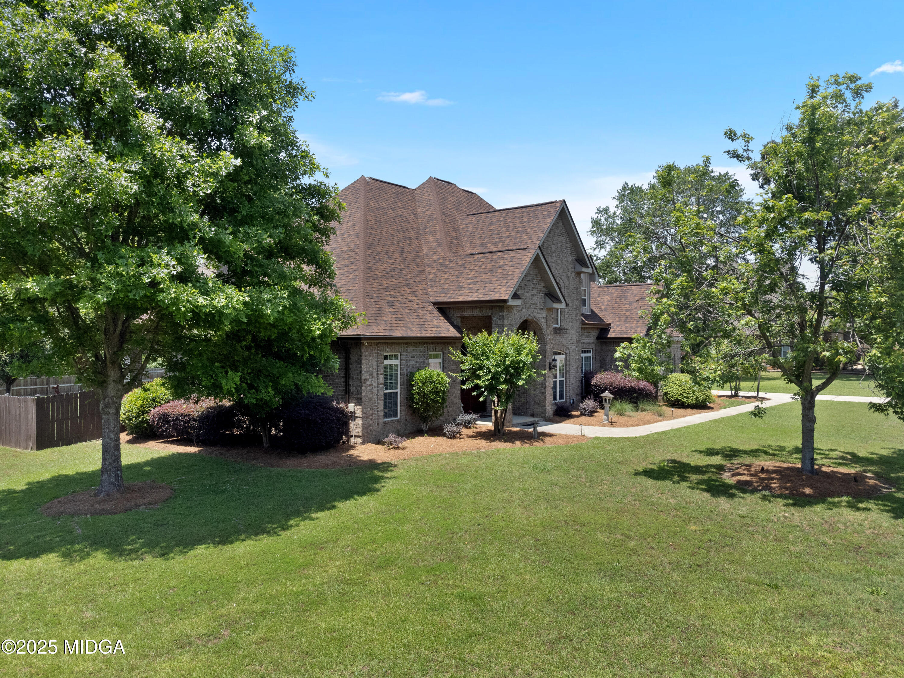105 River Rock Court Perry, GA 31069 - Photo 3 of 61 a view of a house with a yard and a street