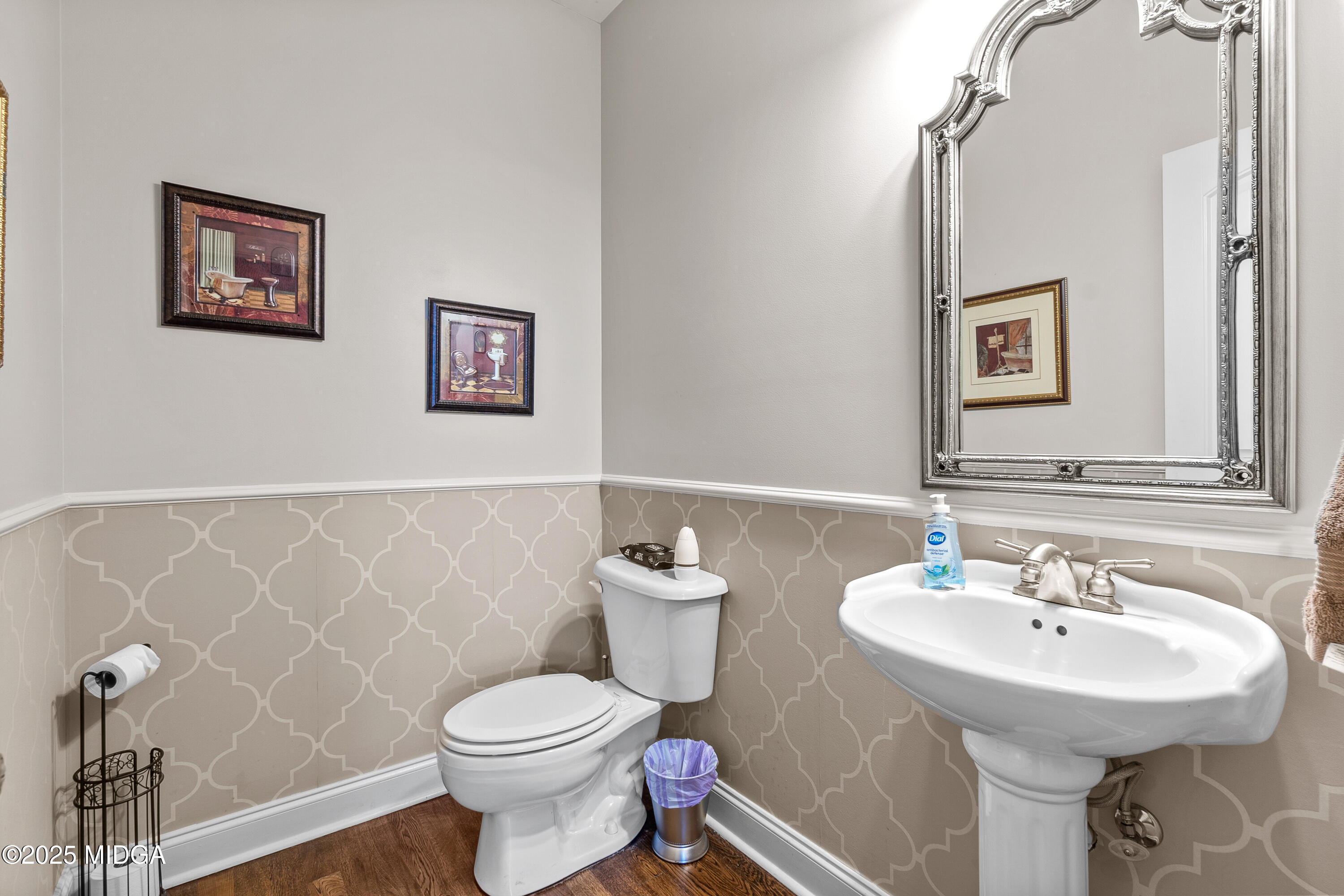 105 River Rock Court Perry, GA 31069 - Photo 39 of 61 a bathroom with a toilet sink and mirror