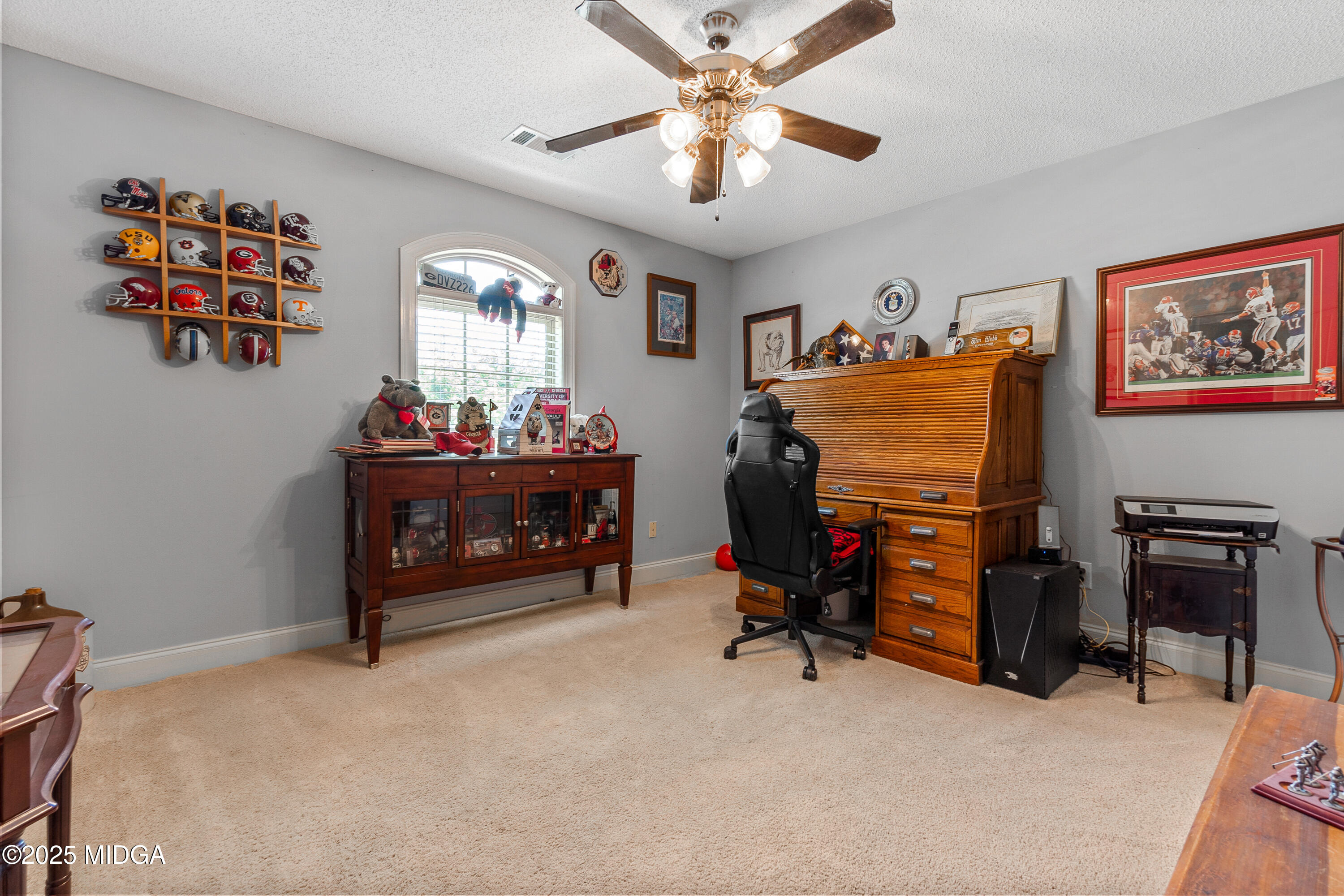 105 River Rock Court Perry, GA 31069 - Photo 40 of 61 a bedroom with furniture and a fan