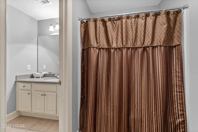 a front view of a house with a yard table and chairs
