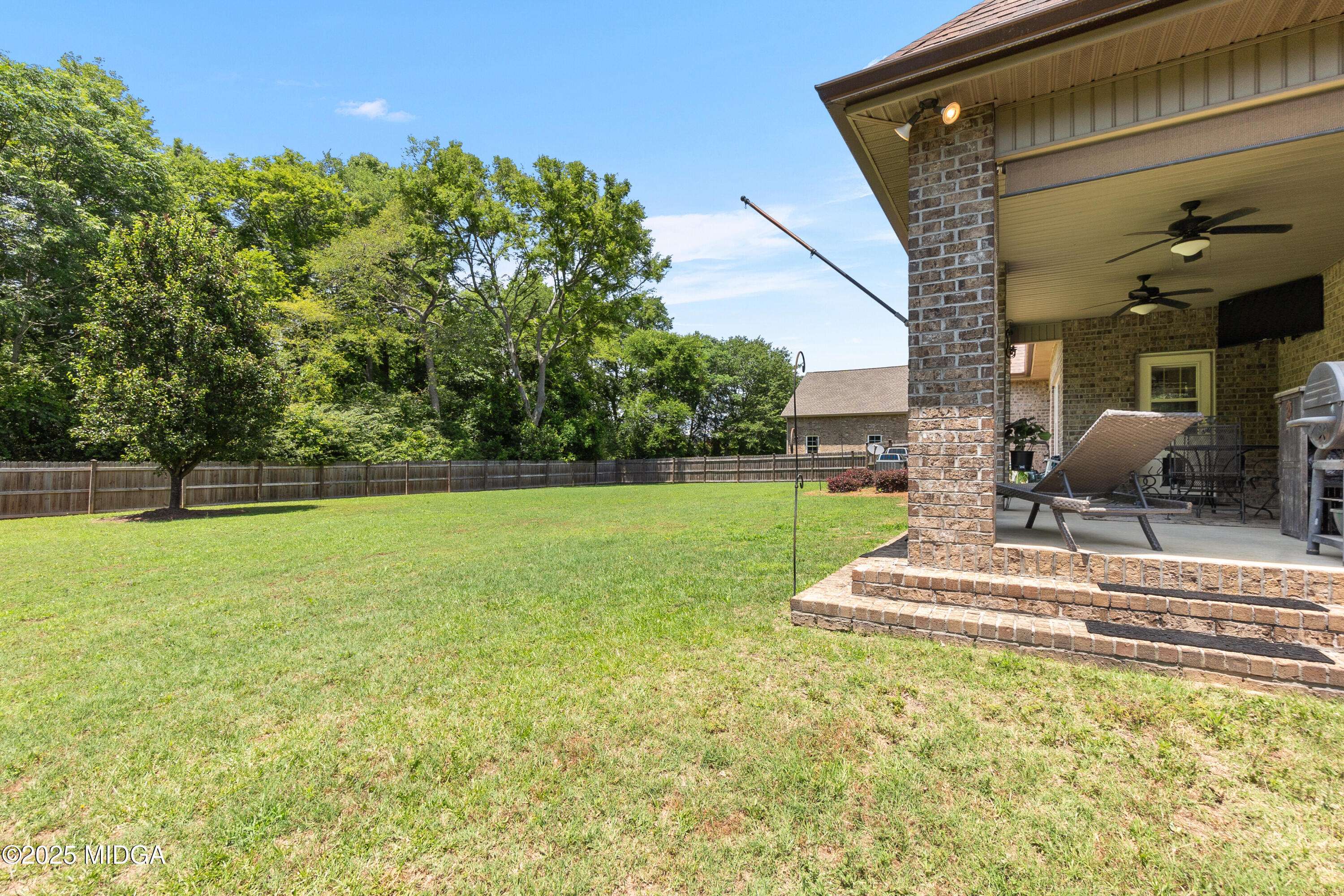 105 River Rock Court Perry, GA 31069 - Photo 53 of 61 a view of a house with a backyard