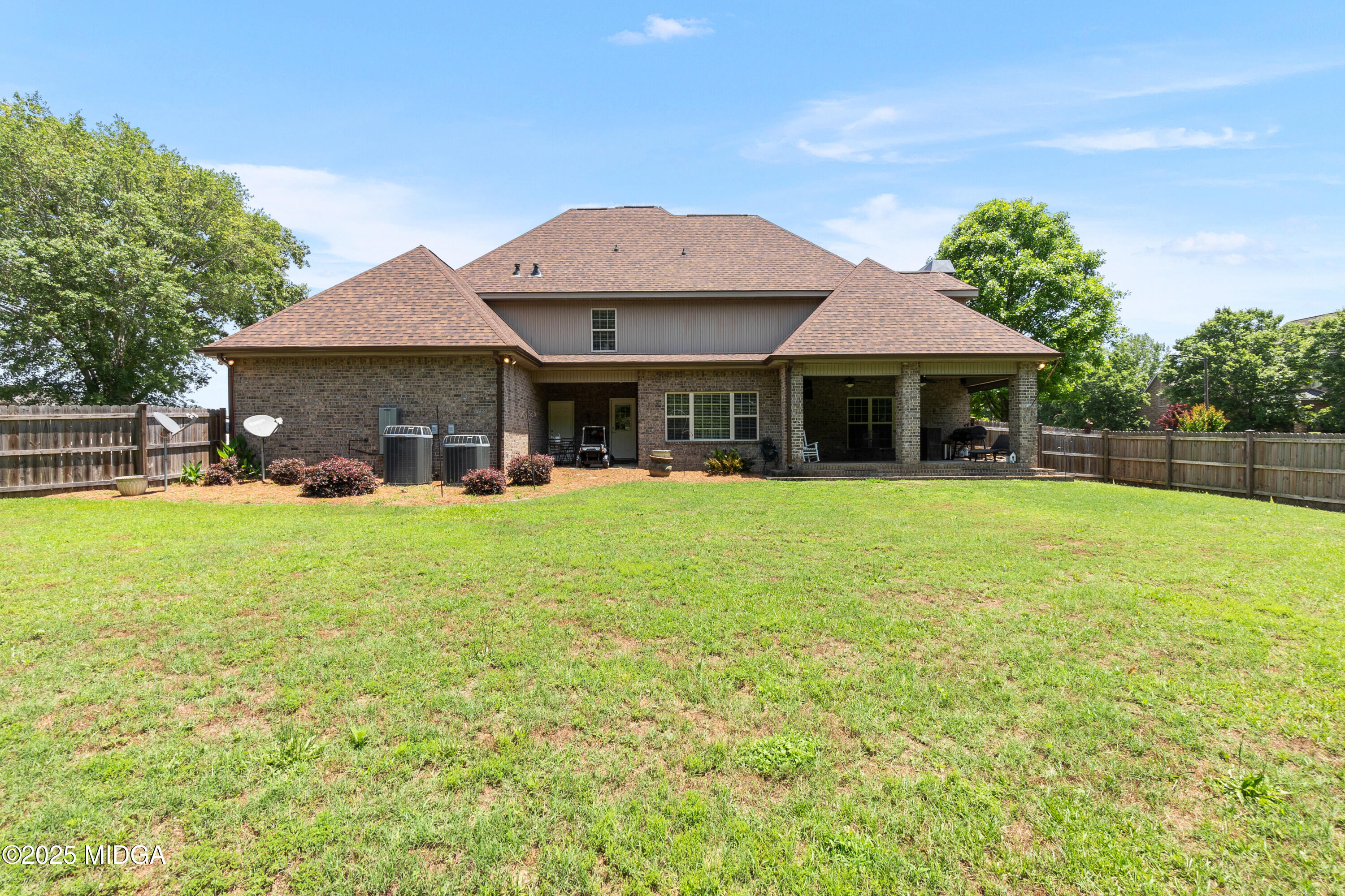 105 River Rock Court Perry, GA 31069 - Photo 56 of 61 a front view of a house with a yard table and chairs