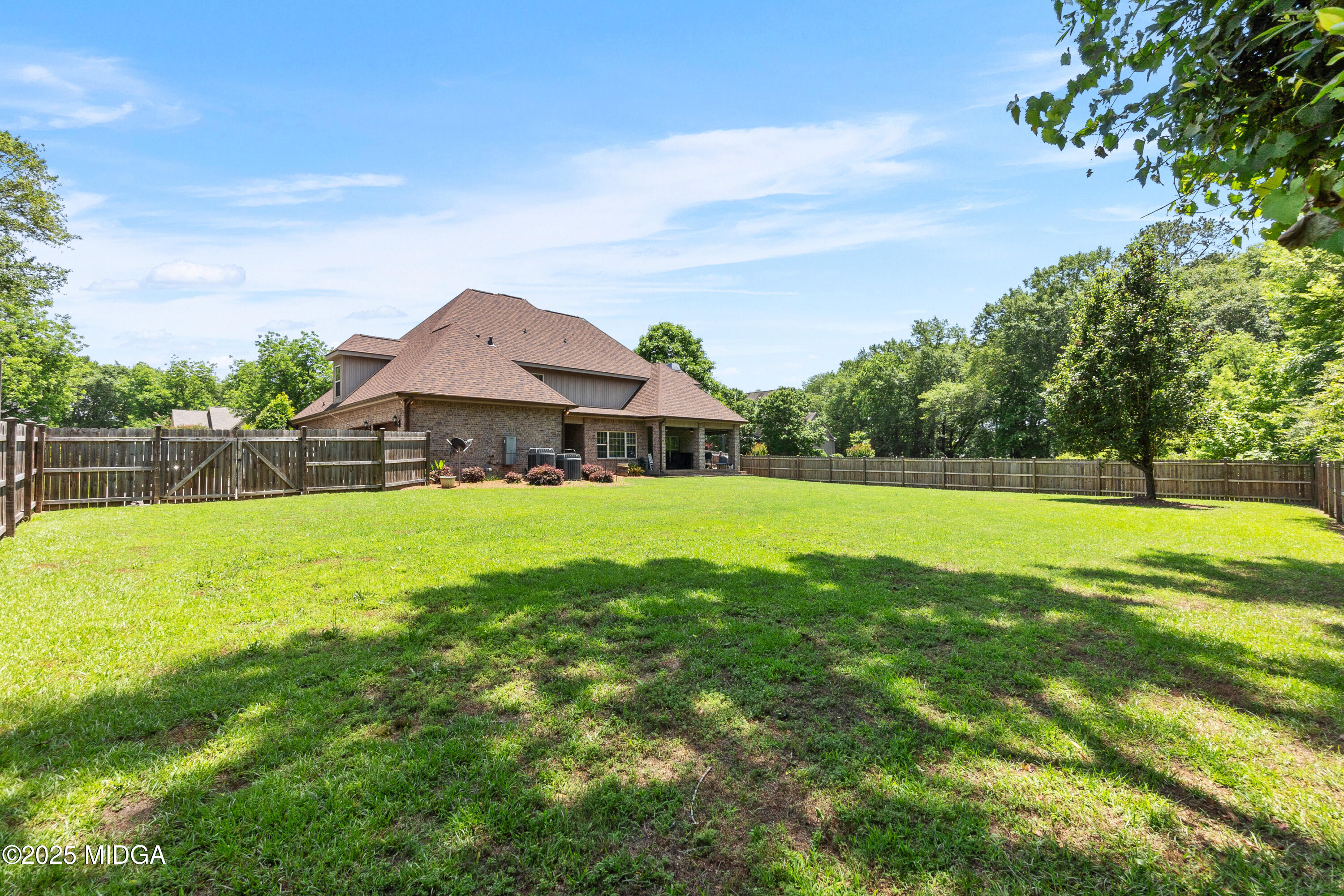 105 River Rock Court Perry, GA 31069 - Photo 57 of 61 a aerial view of a house with swimming pool and a yard