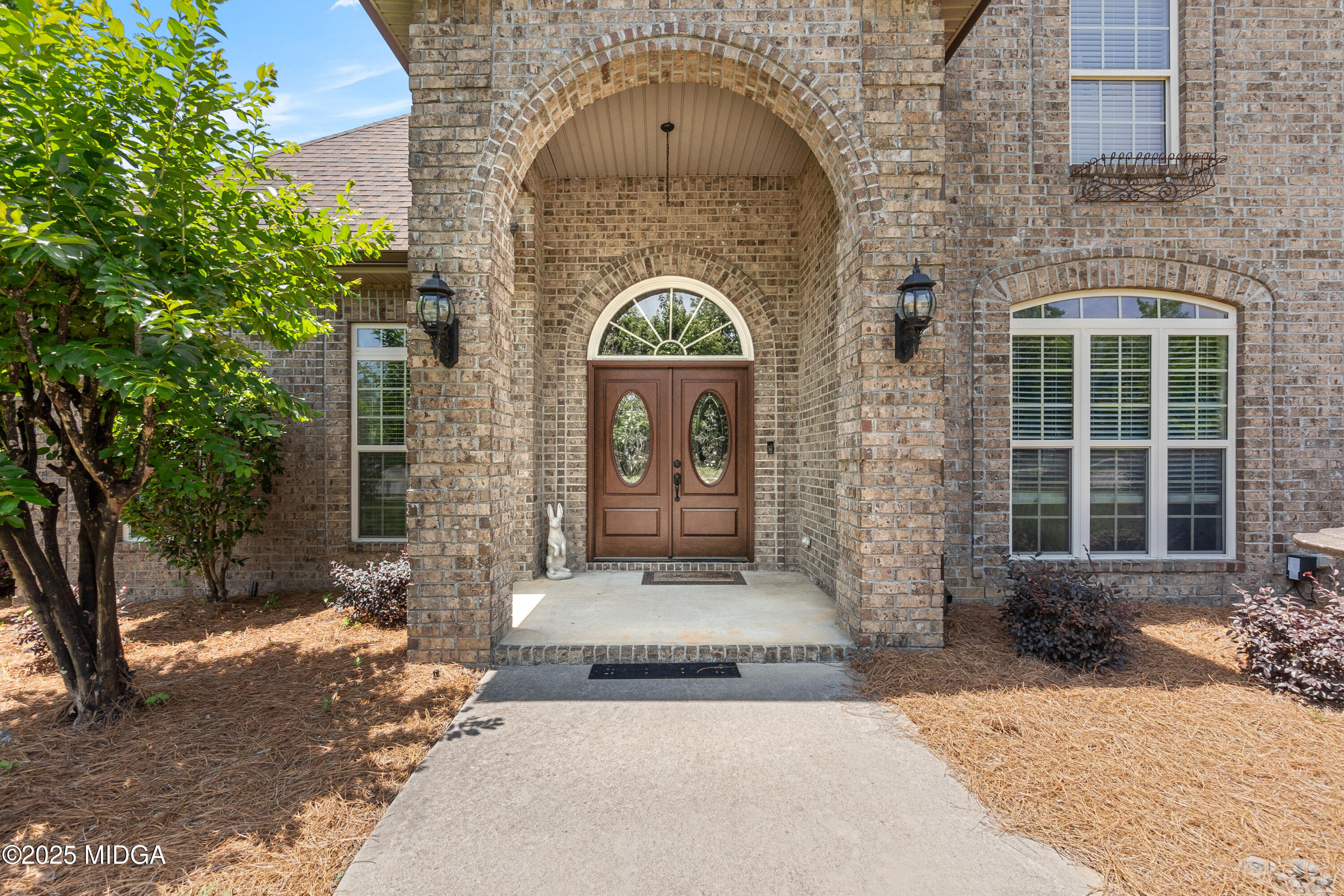 105 River Rock Court Perry, GA 31069 - Photo 6 of 61 a front view of a house with a garden