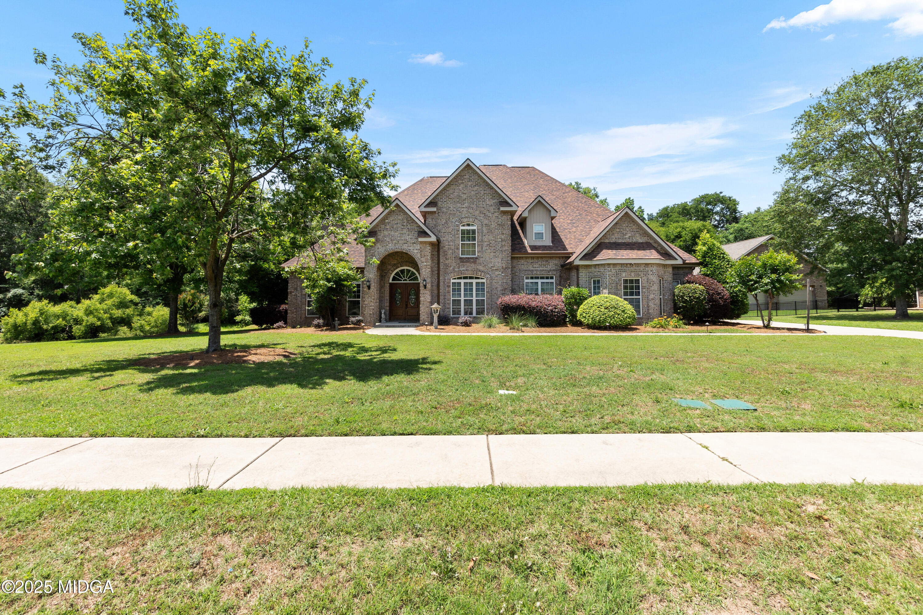 105 River Rock Court Perry, GA 31069 - Photo 8 of 61 a front view of a house with yard and green space