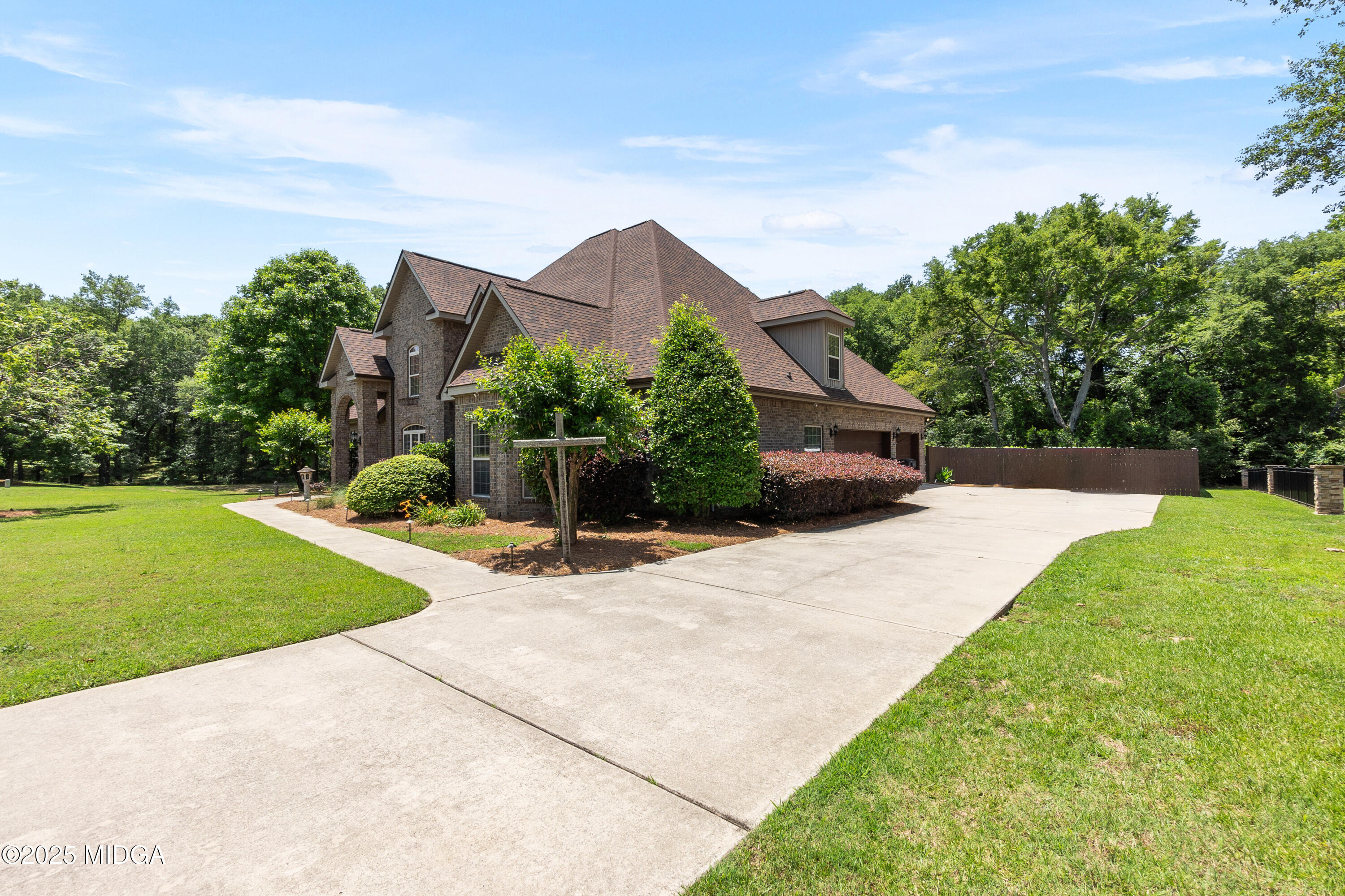 105 River Rock Court Perry, GA 31069 - Photo 10 of 61 a front view of a house with a yard and trees