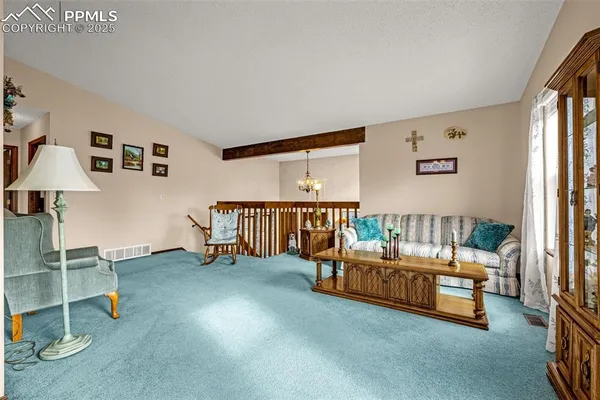 a bedroom with furniture and a book shelf