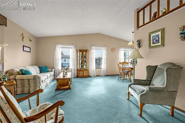 a living room with furniture and a table