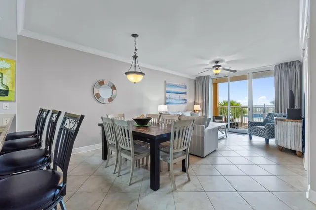 a view of a dining room with furniture and a chandelier