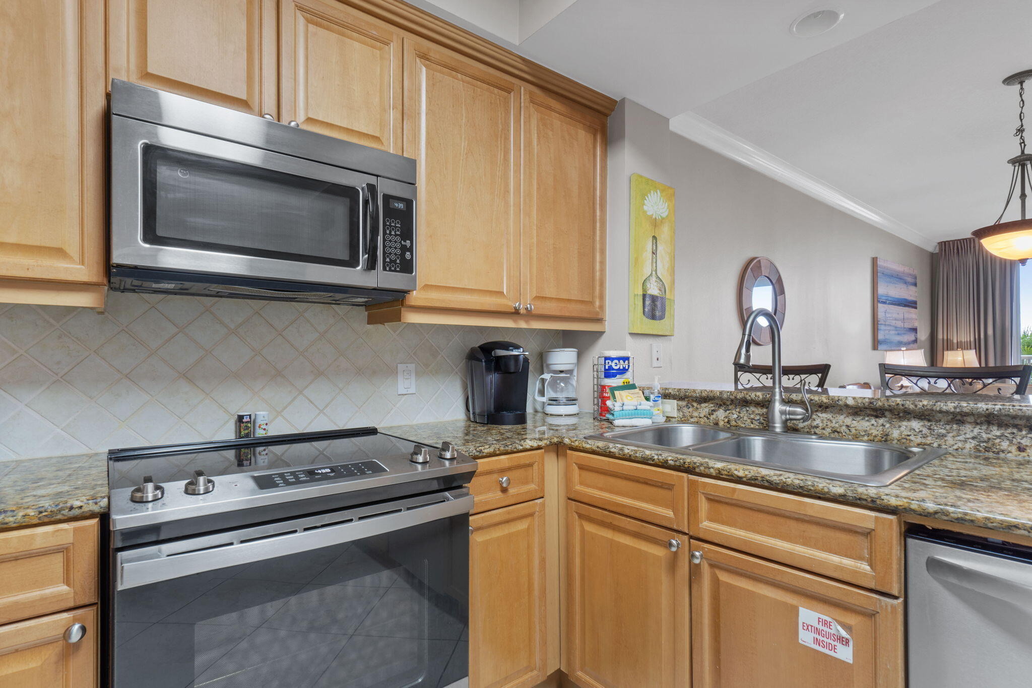1150 Santa Rosa Boulevard, Unit 113 Fort Walton Beach, FL 32548 - Photo 21 of 71 a kitchen with a stove and a microwave