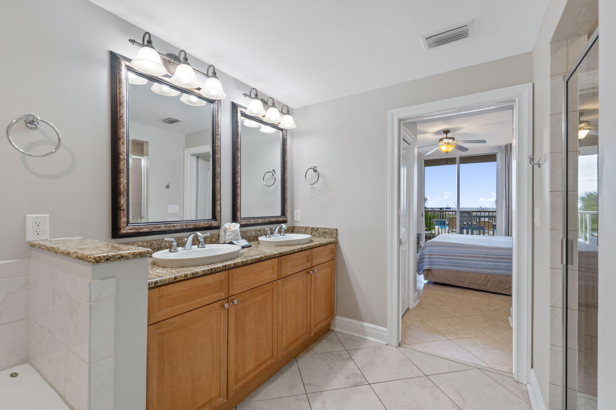 1150 Santa Rosa Boulevard, Unit 113 Fort Walton Beach, FL 32548 - Photo 29 of 71 a bathroom with a double vanity sink and a mirror