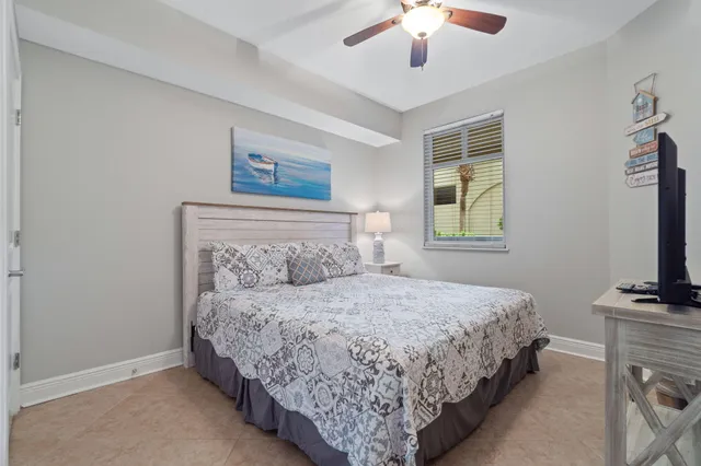 a bedroom with a bed and a tv