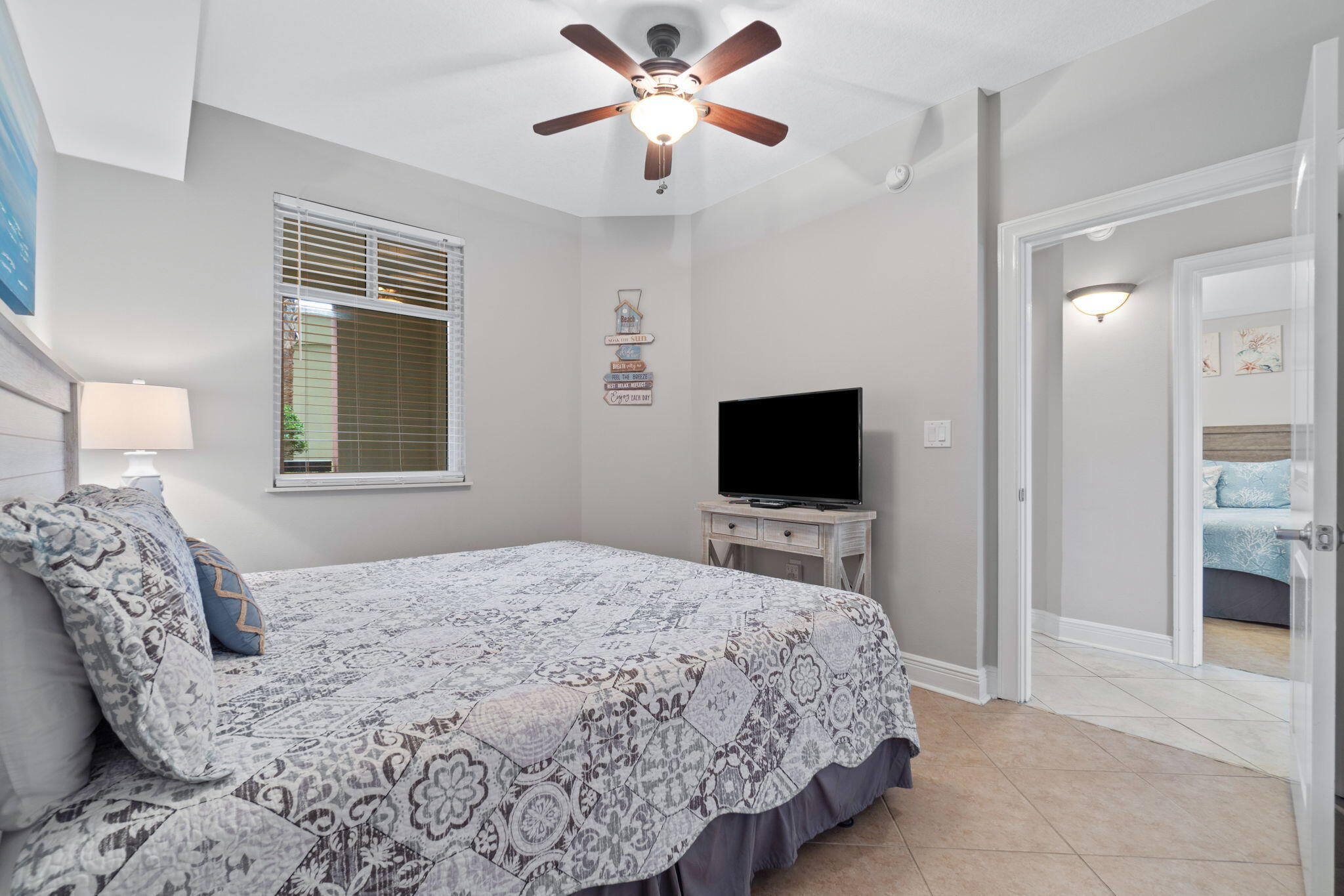 1150 Santa Rosa Boulevard, Unit 113 Fort Walton Beach, FL 32548 - Photo 36 of 71 a bedroom with a bed and a flat screen tv