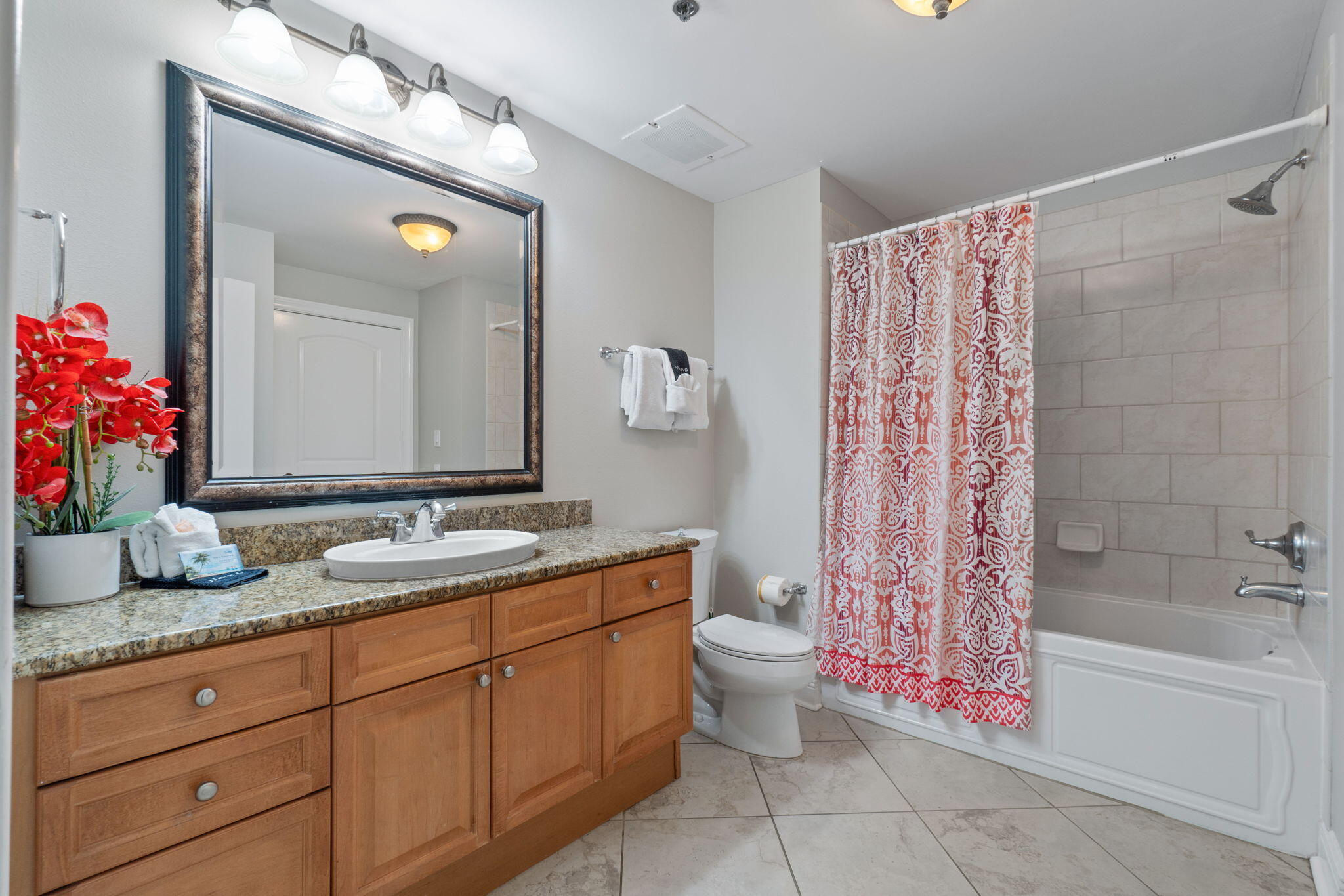 1150 Santa Rosa Boulevard, Unit 113 Fort Walton Beach, FL 32548 - Photo 38 of 71 a bathroom with a granite countertop sink and a mirror
