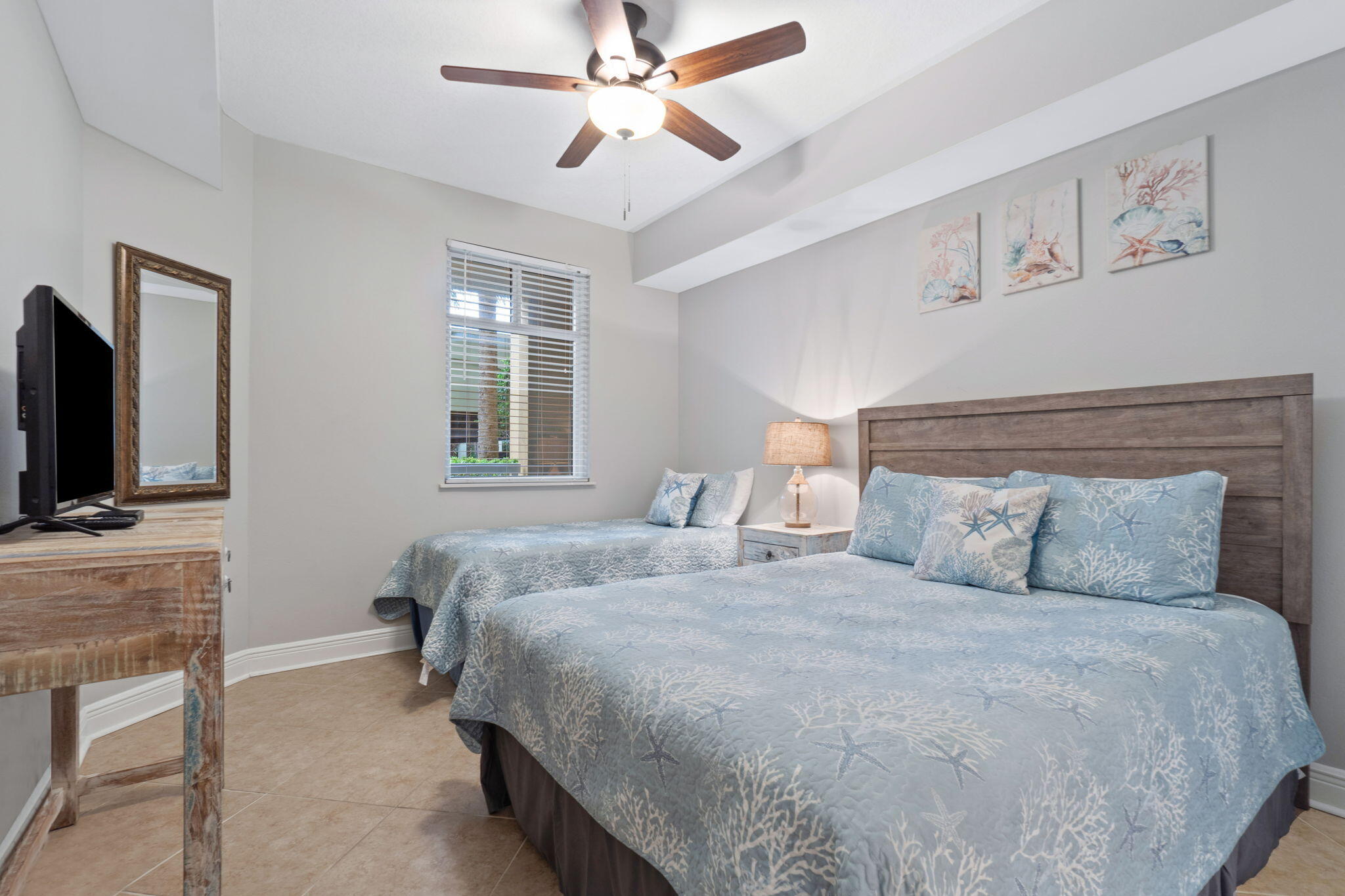 1150 Santa Rosa Boulevard, Unit 113 Fort Walton Beach, FL 32548 - Photo 39 of 71 a bedroom with a bed and a flat screen tv