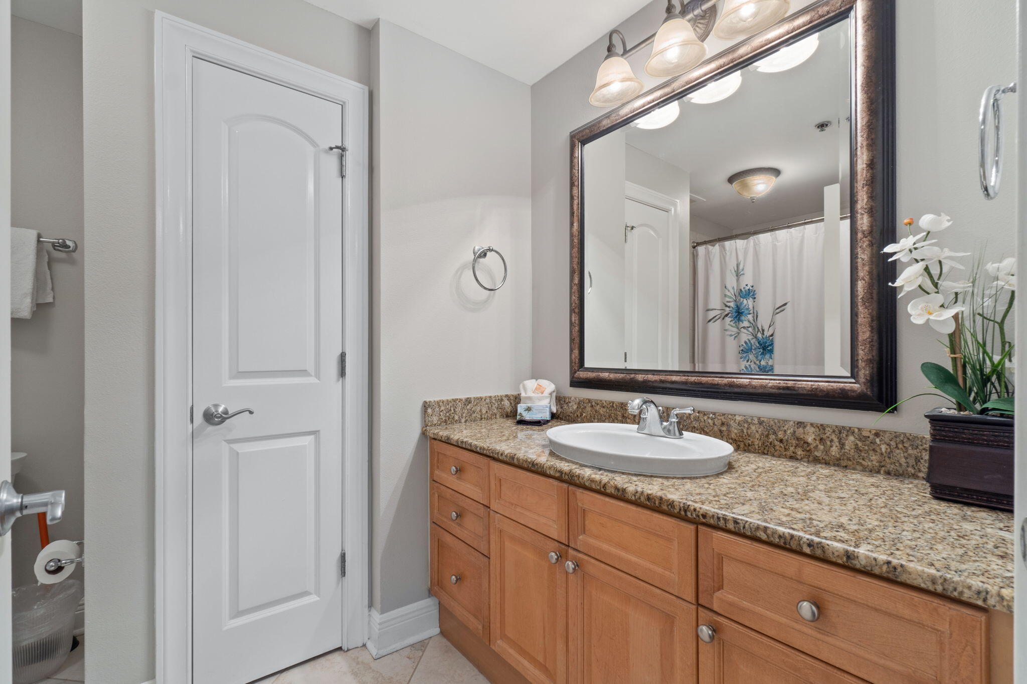 1150 Santa Rosa Boulevard, Unit 113 Fort Walton Beach, FL 32548 - Photo 43 of 71 a bathroom with a granite countertop sink a mirror and a shower