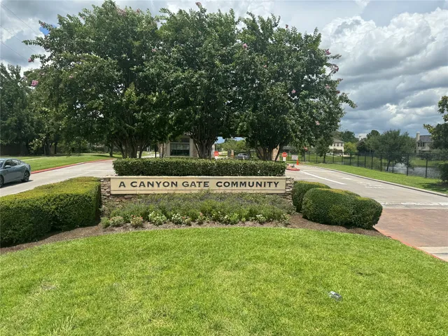 a view of a park that has large trees