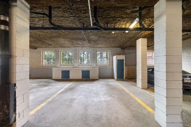 a view of an empty room with a fireplace