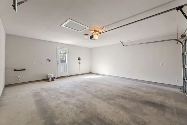 a view of an empty room with a ceiling fan
