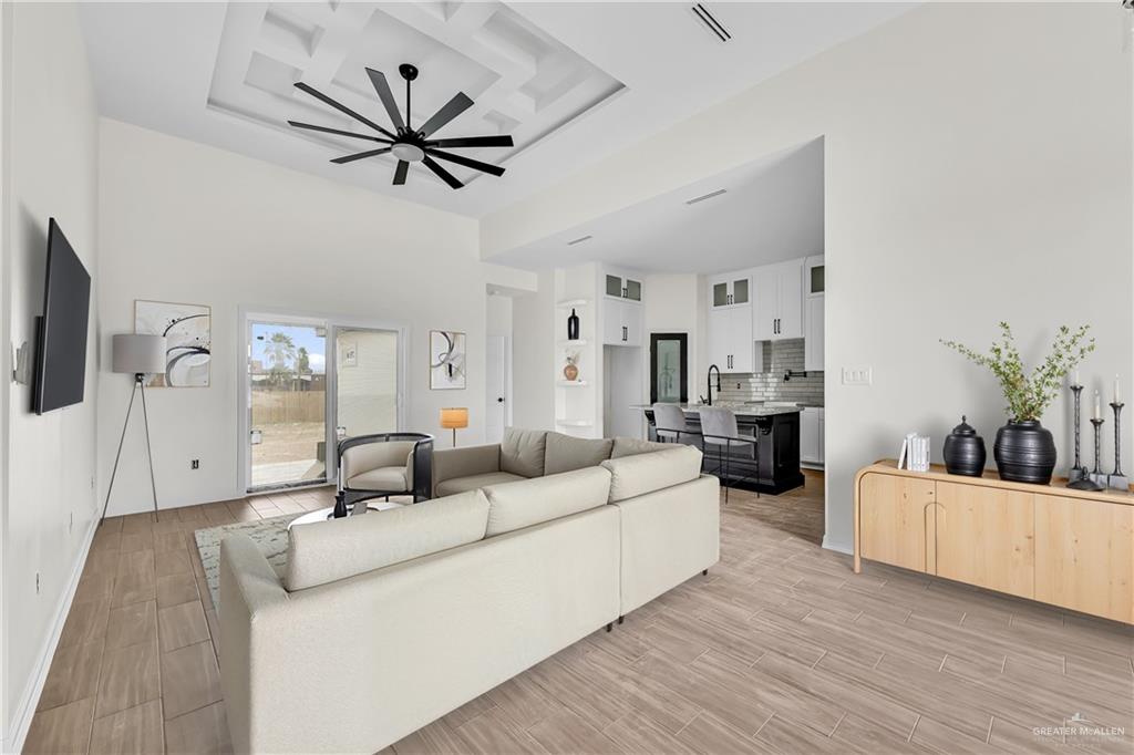 3516 East Alexa Street Edinburg, TX 78542 - Photo 17 of 25 a living room with furniture and a large window
