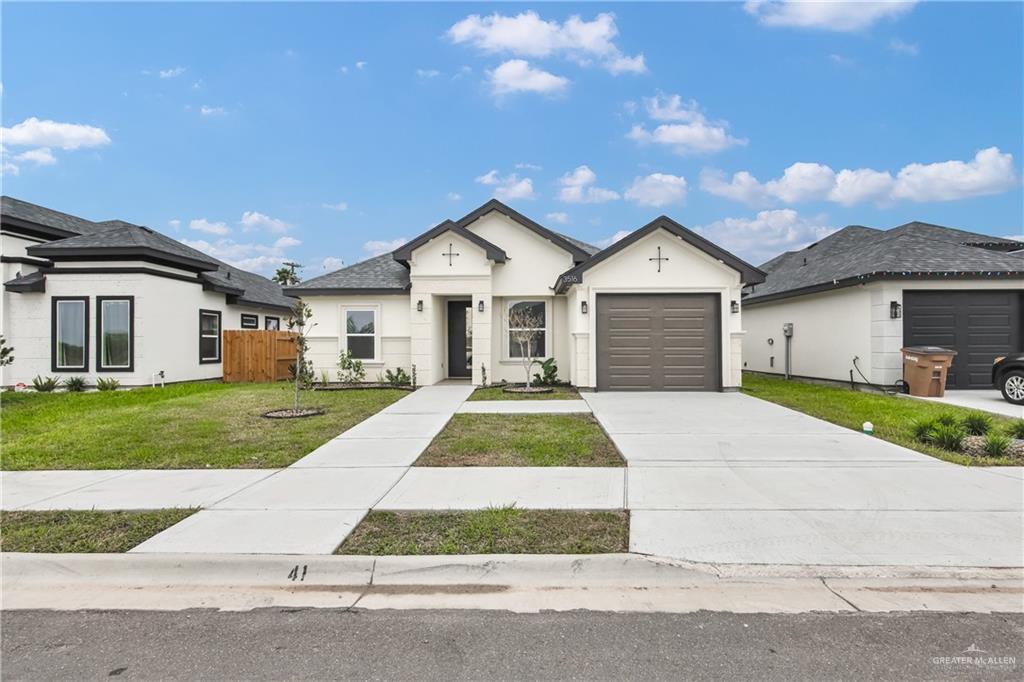 3516 East Alexa Street Edinburg, TX 78542 - Photo 2 of 25 a front view of a house with a yard