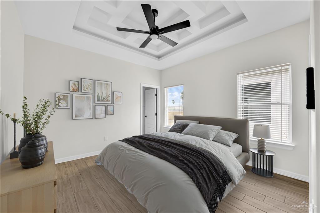 3516 East Alexa Street Edinburg, TX 78542 - Photo 10 of 25 a bedroom with a bed ceiling fan and a window