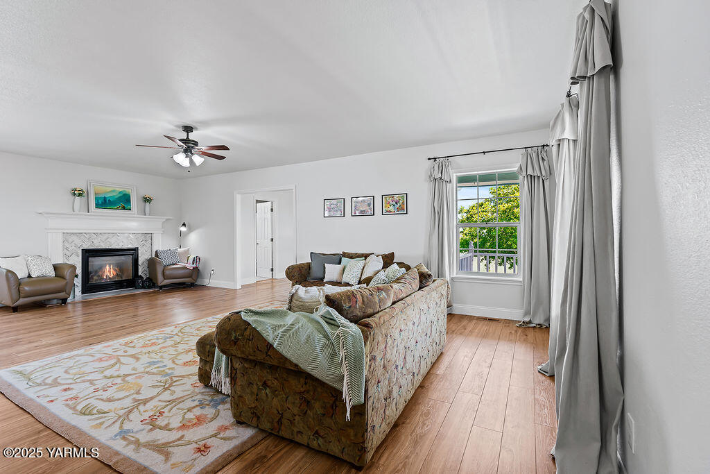 11809 Occidental Road Yakima, WA 98908 - Photo 15 of 60 a living room with furniture and a fireplace