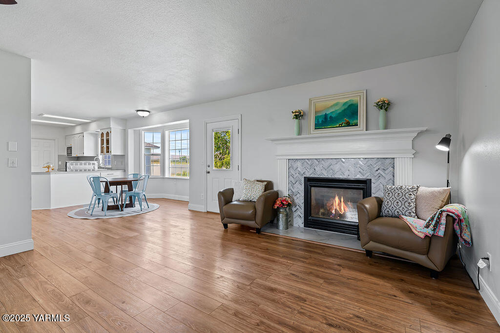 11809 Occidental Road Yakima, WA 98908 - Photo 17 of 60 a living room with furniture and a fireplace