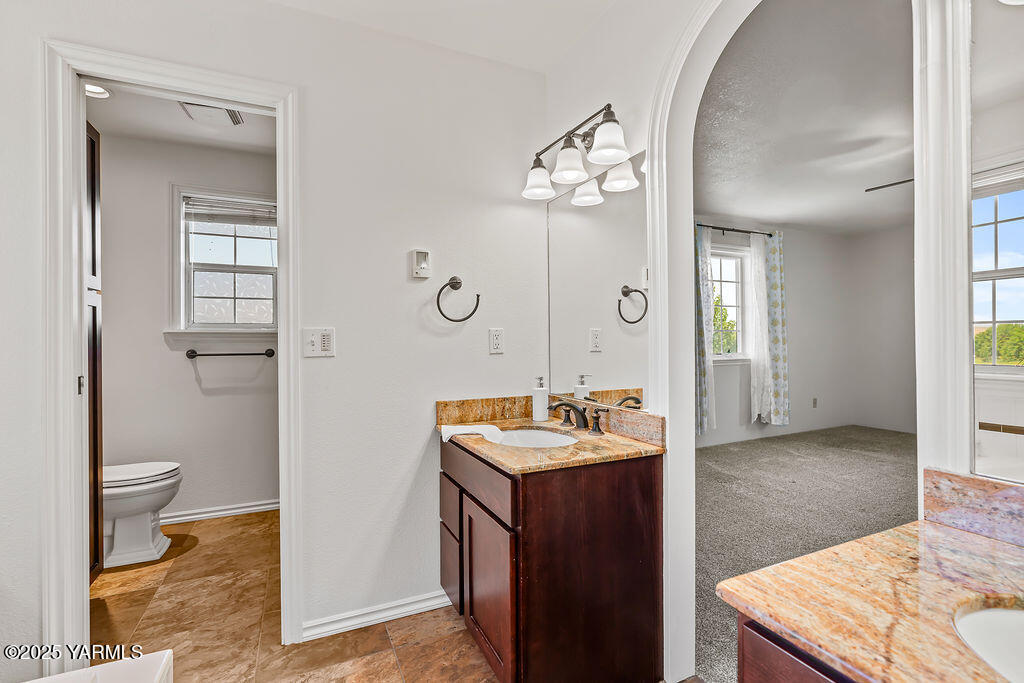 11809 Occidental Road Yakima, WA 98908 - Photo 36 of 60 a spacious bathroom with a sink a toilet and shower
