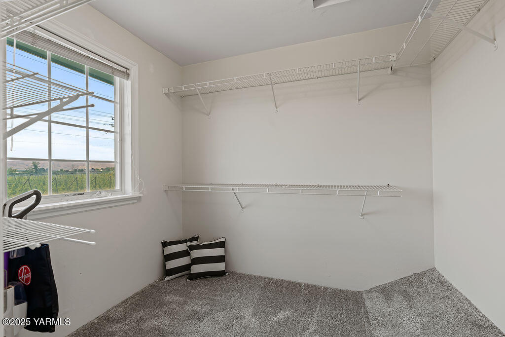 11809 Occidental Road Yakima, WA 98908 - Photo 38 of 60 a view of a room with racks on the wall