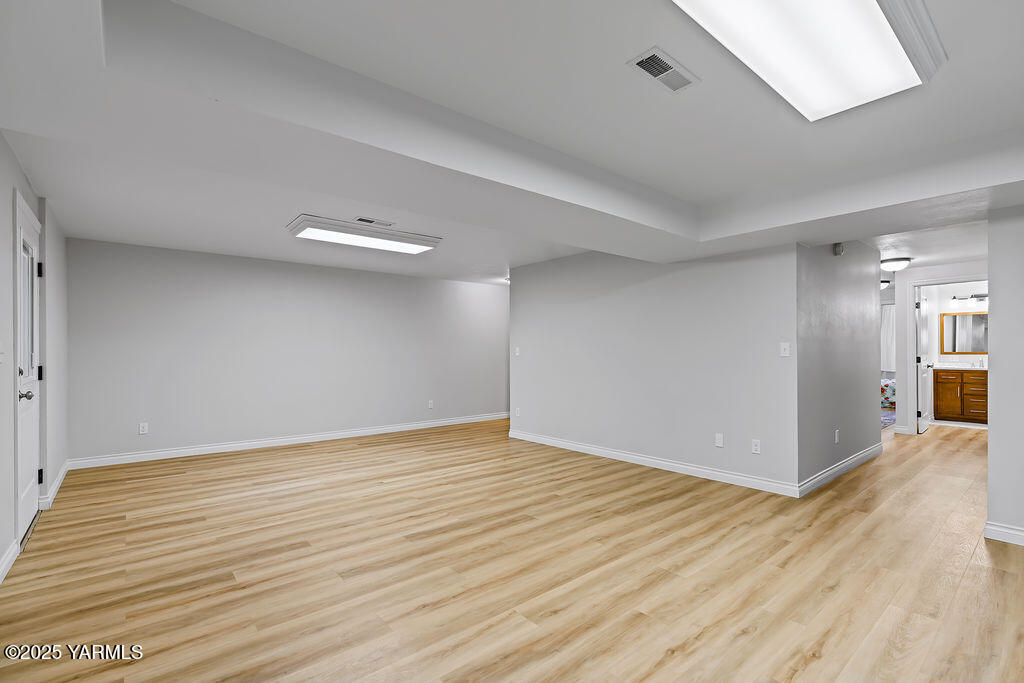 11809 Occidental Road Yakima, WA 98908 - Photo 42 of 60 a view of an empty room with wooden floor